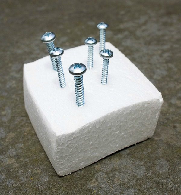 A trick for spray painting nails - stick them in styrofoam!