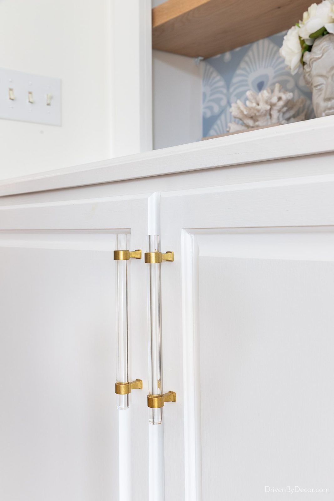 Pair of acrylic cabinet pulls on cabinet