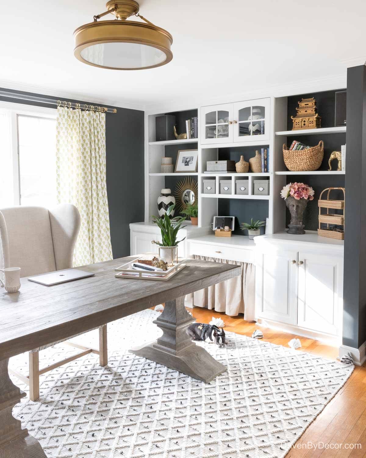 Brass flush mount ceiling light above the desk in our home office