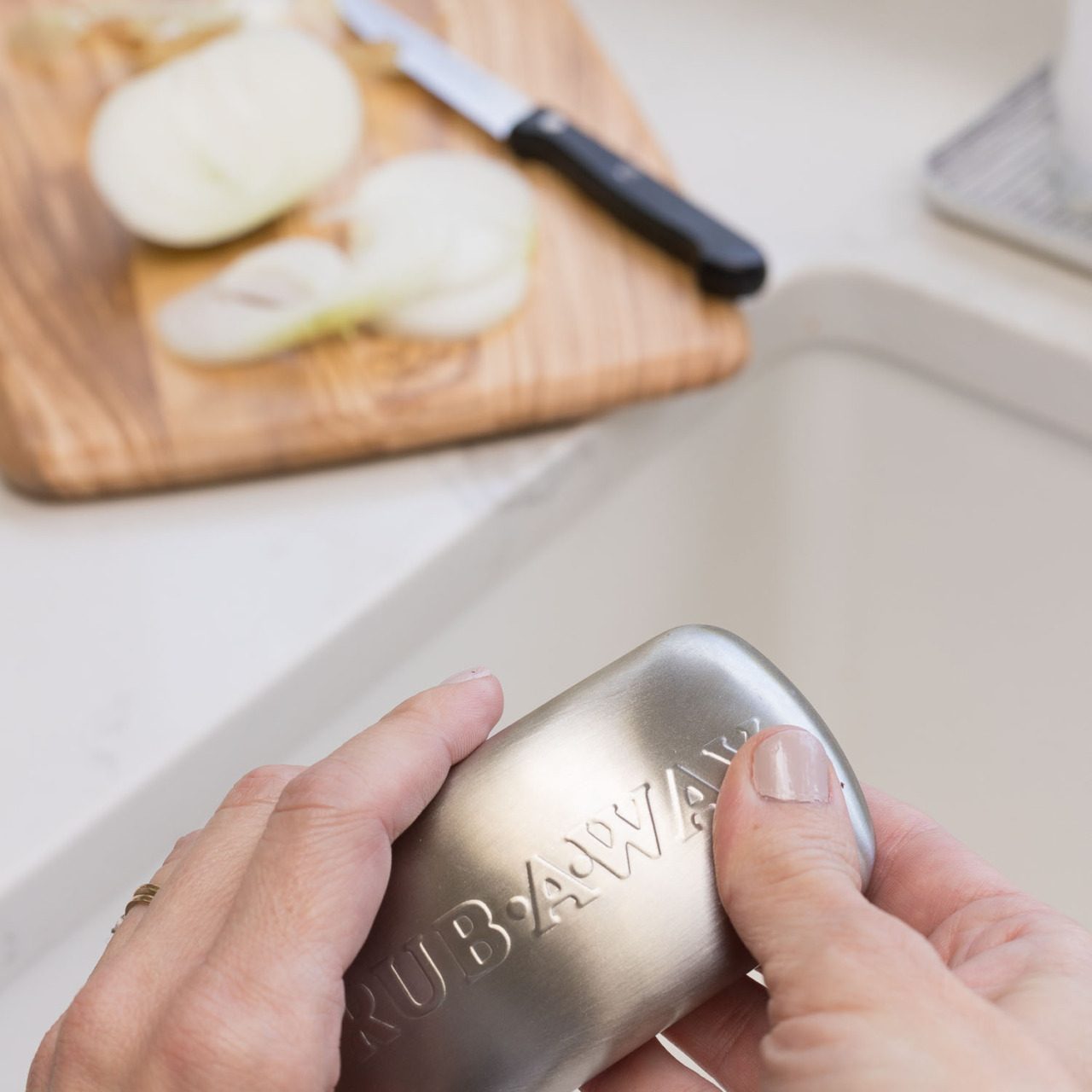 No clue how it works but it takes away the smell of onions and other gross smells from your hands!
