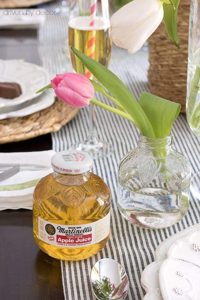 The CUTEST little vases that are actually single serve apple juice bottles with the label soaked off!