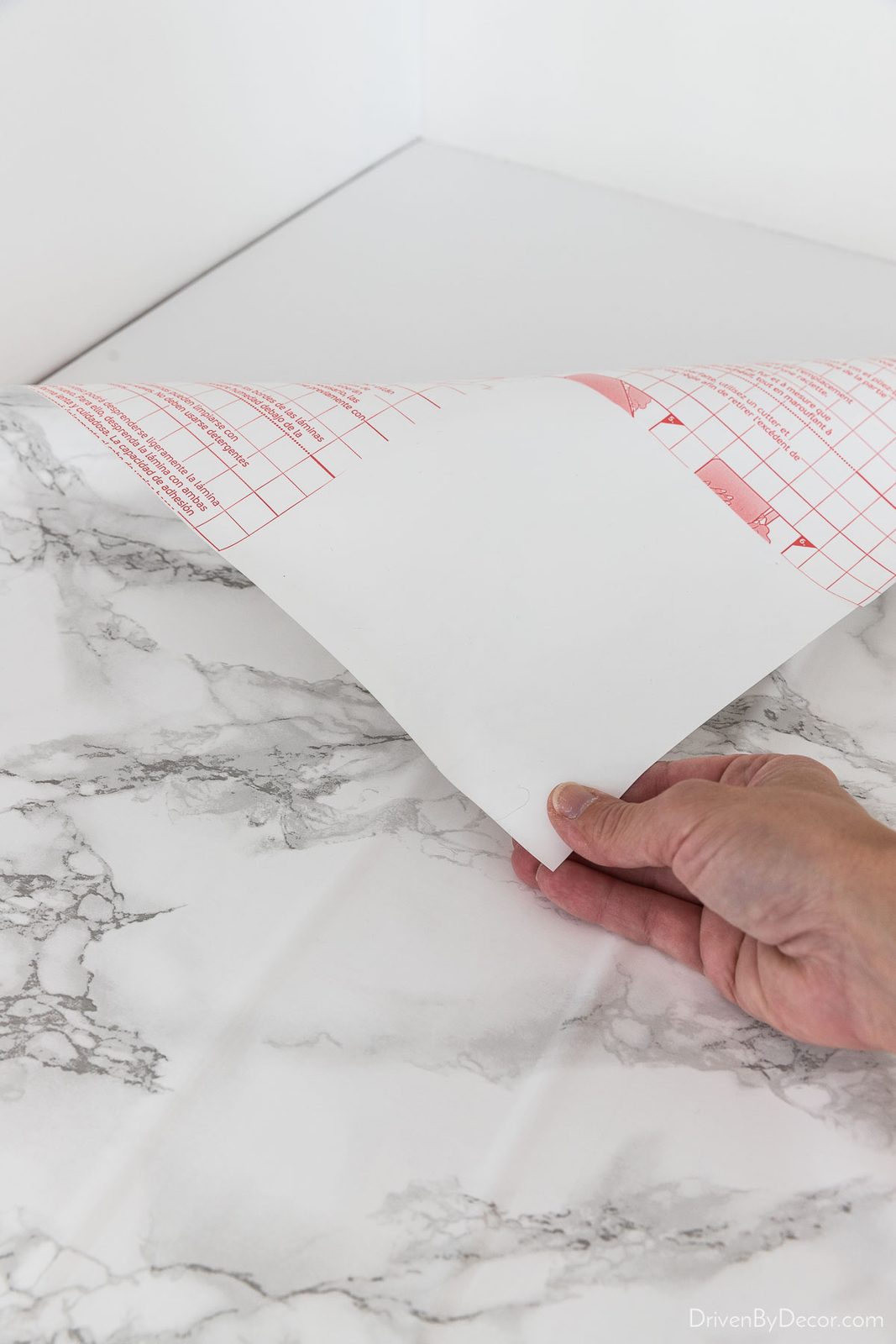 The first step in applying marble contact paper to the countertop