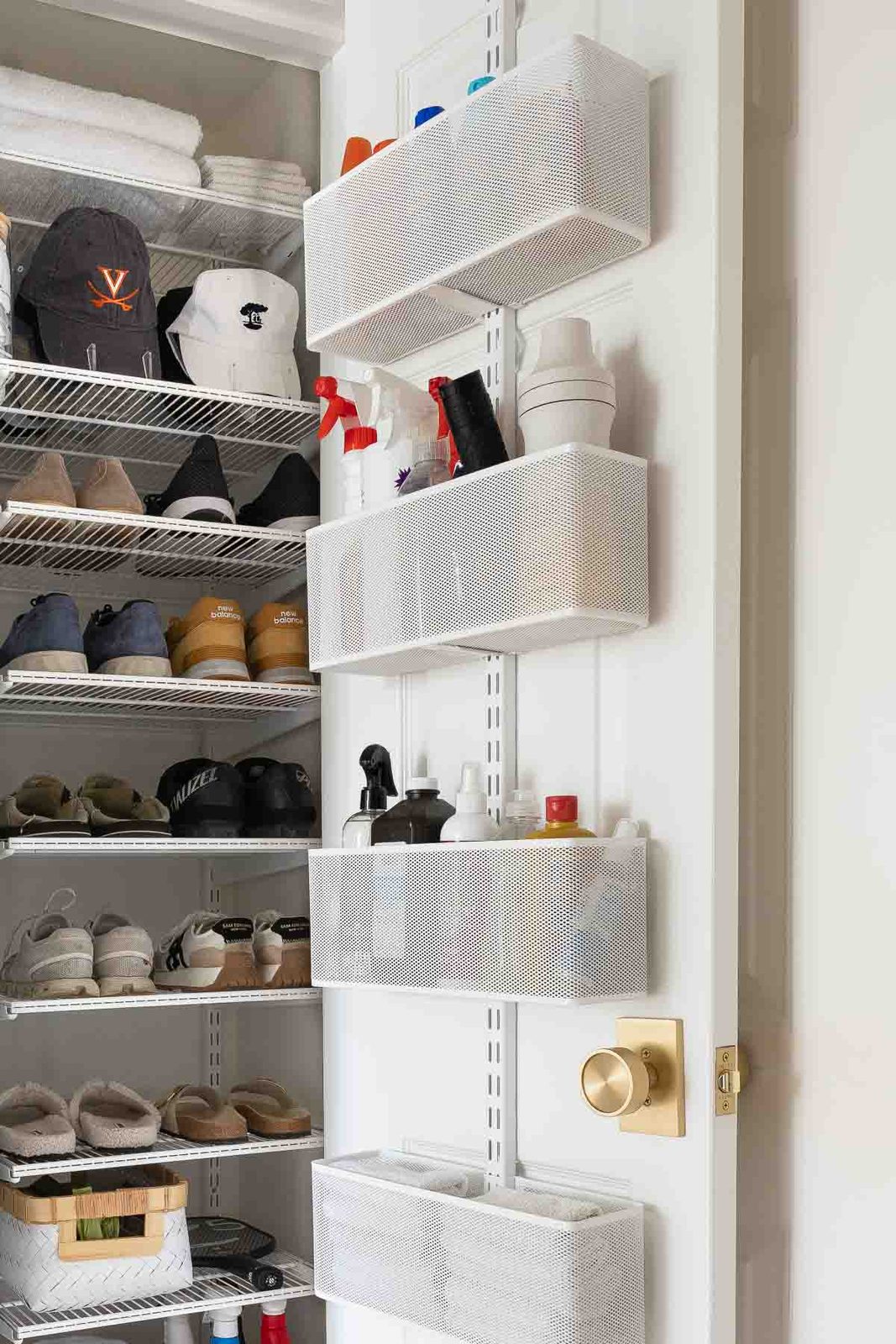 Mesh baskets on back of door organizer in laundry room
