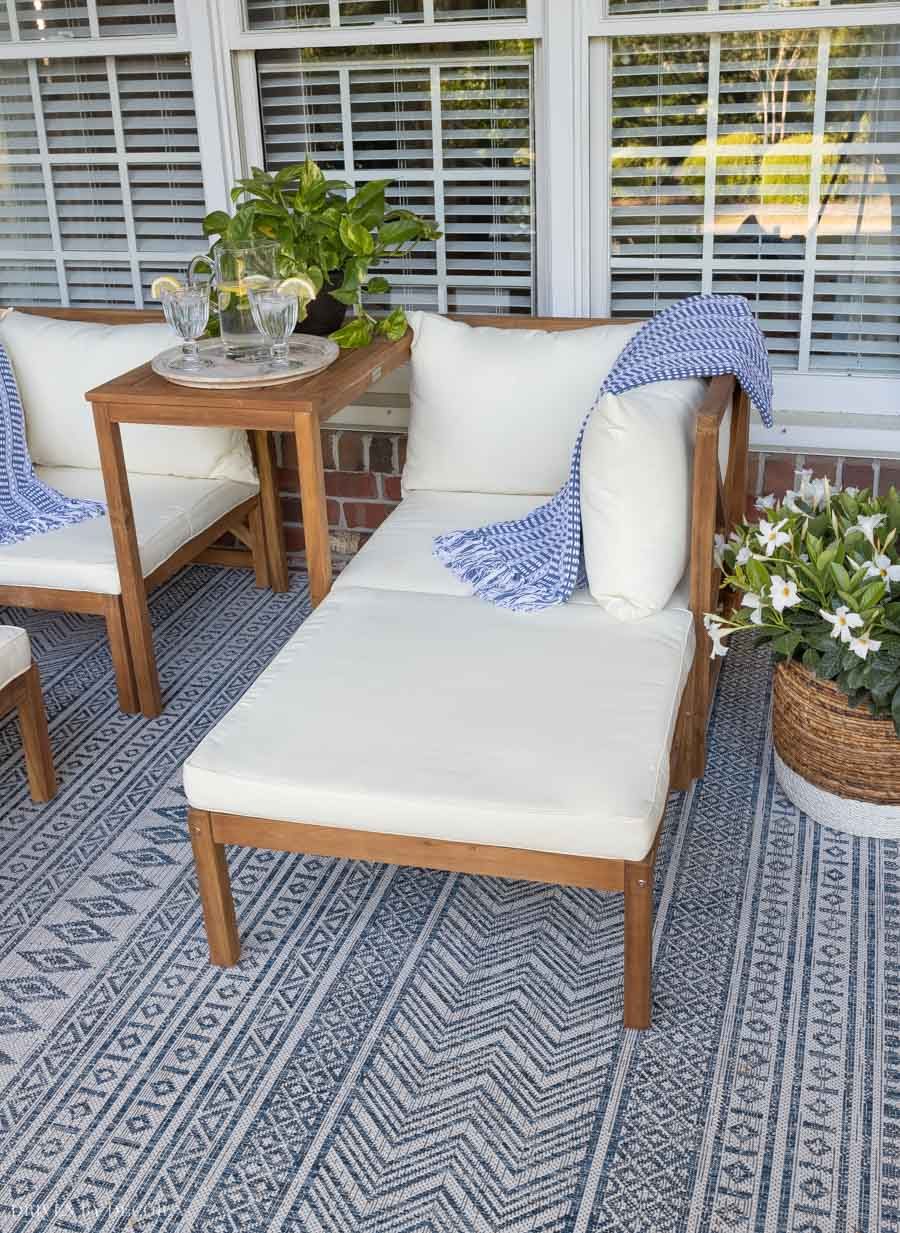 Love this furniture on her back porch - you can push the ottomans in to use them as loungers!