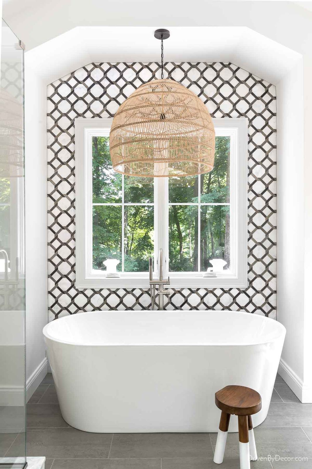 Tiling an accent wall behind bathtub as part of a budget bathroom remodel