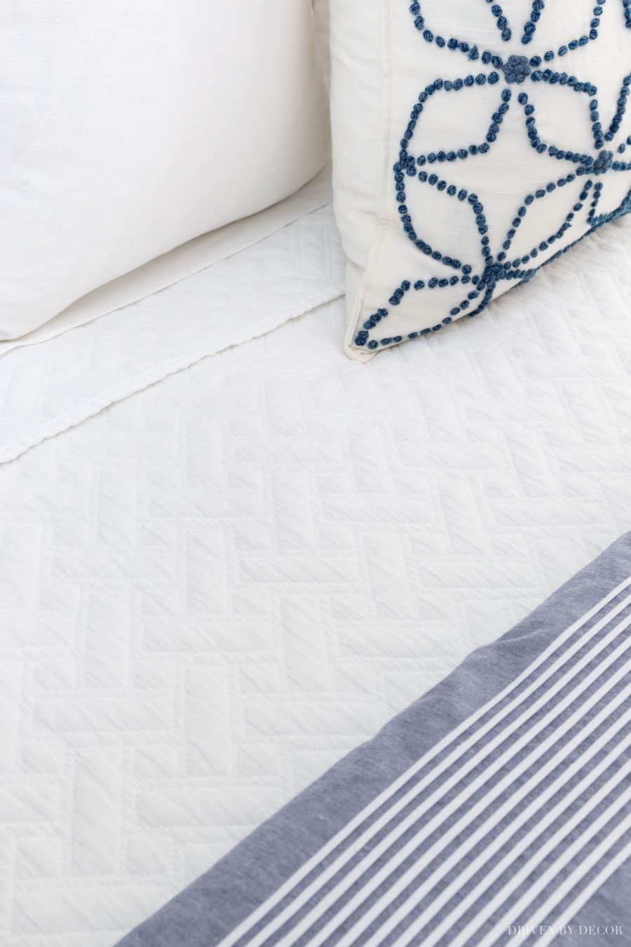 LOVE this basketweave coverlet! One of the bedding essentials in this bed making 101 post!