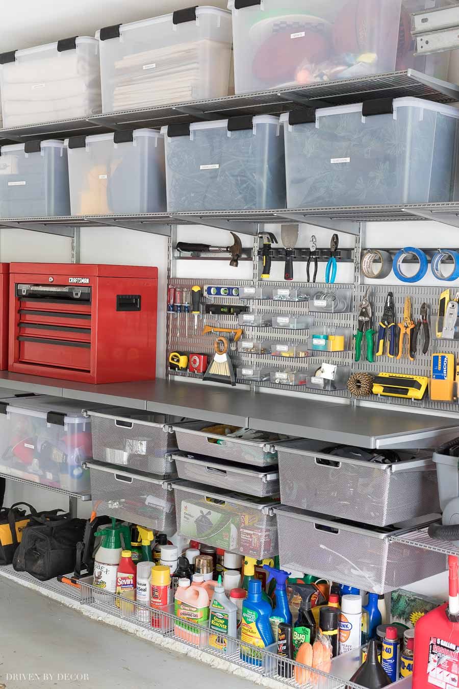 Love the smooth, heavy duty Elfa utility work surface integrated into this organized garage system!