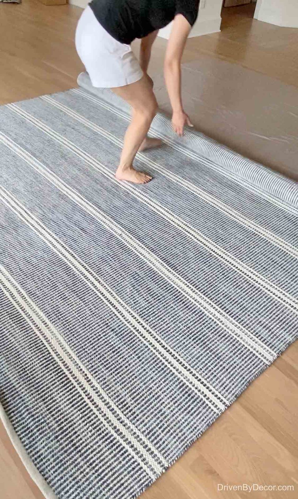 Rolling out our new blue and white family room rug!
