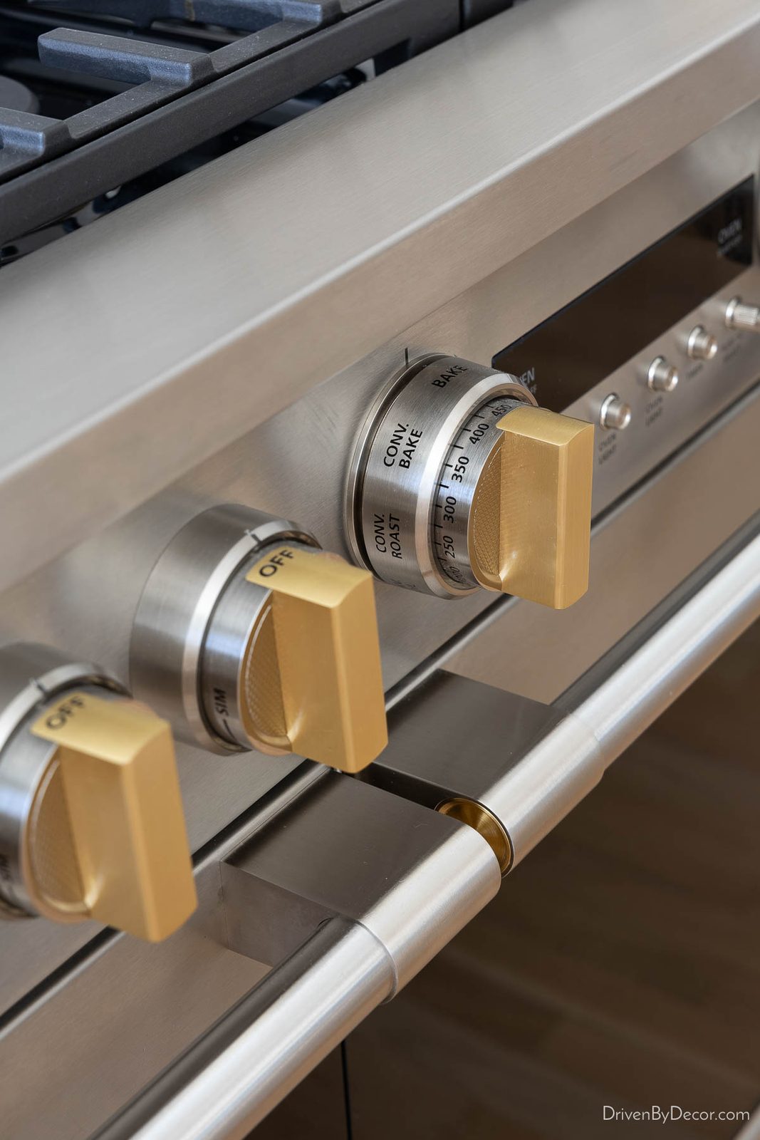 Brass knobs on Monogram range