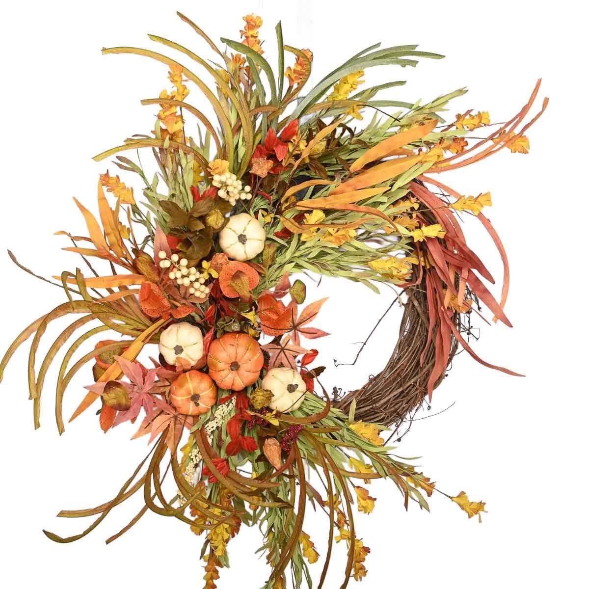 Budget friendly fall wreath with autumnal grasses and pumpkins