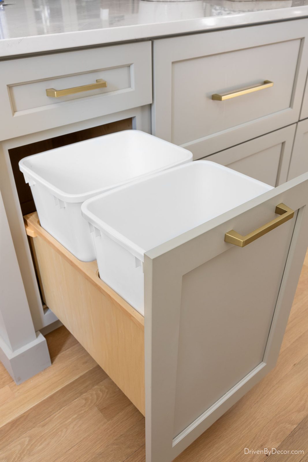 Built-in double trash can pullout in kitchen