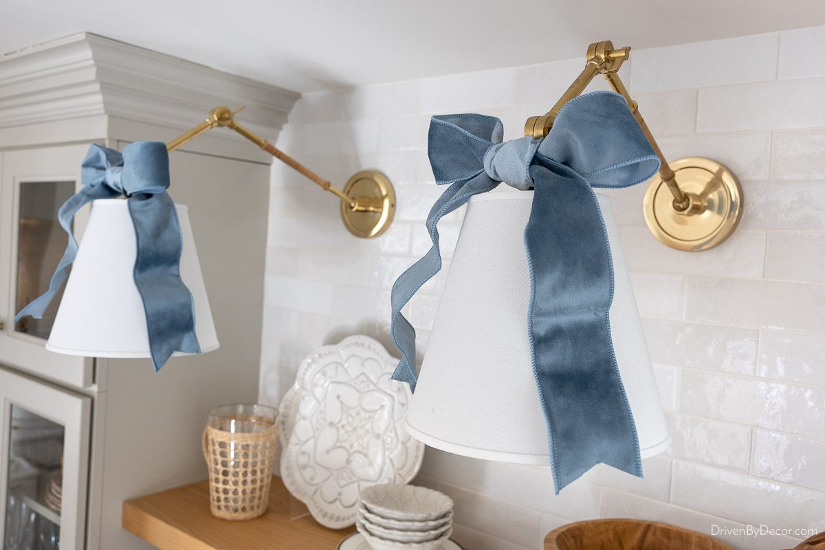 Sconces above coffee bar with light blue velvet bows