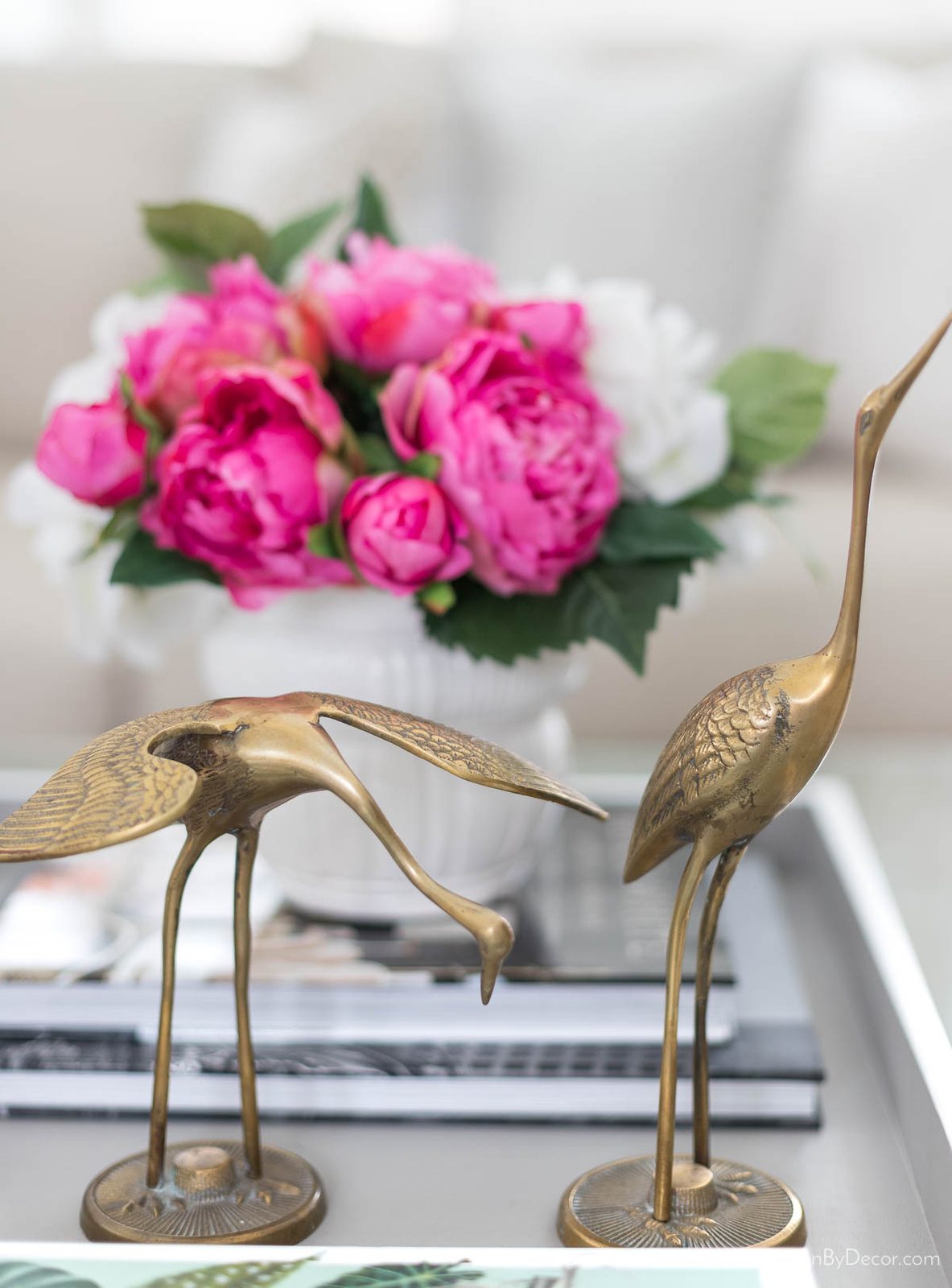 Brass cranes as coffee table decor