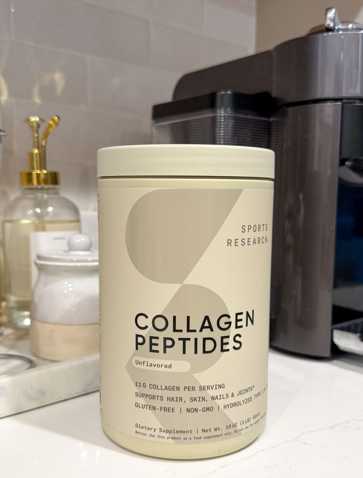 Collagen peptides powder in front of coffee station