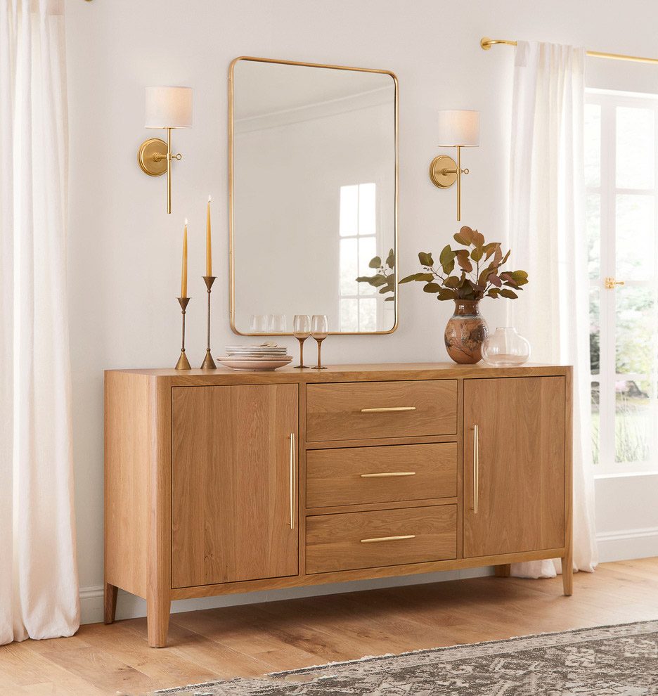 Sconces flanking a mirror as console table decor