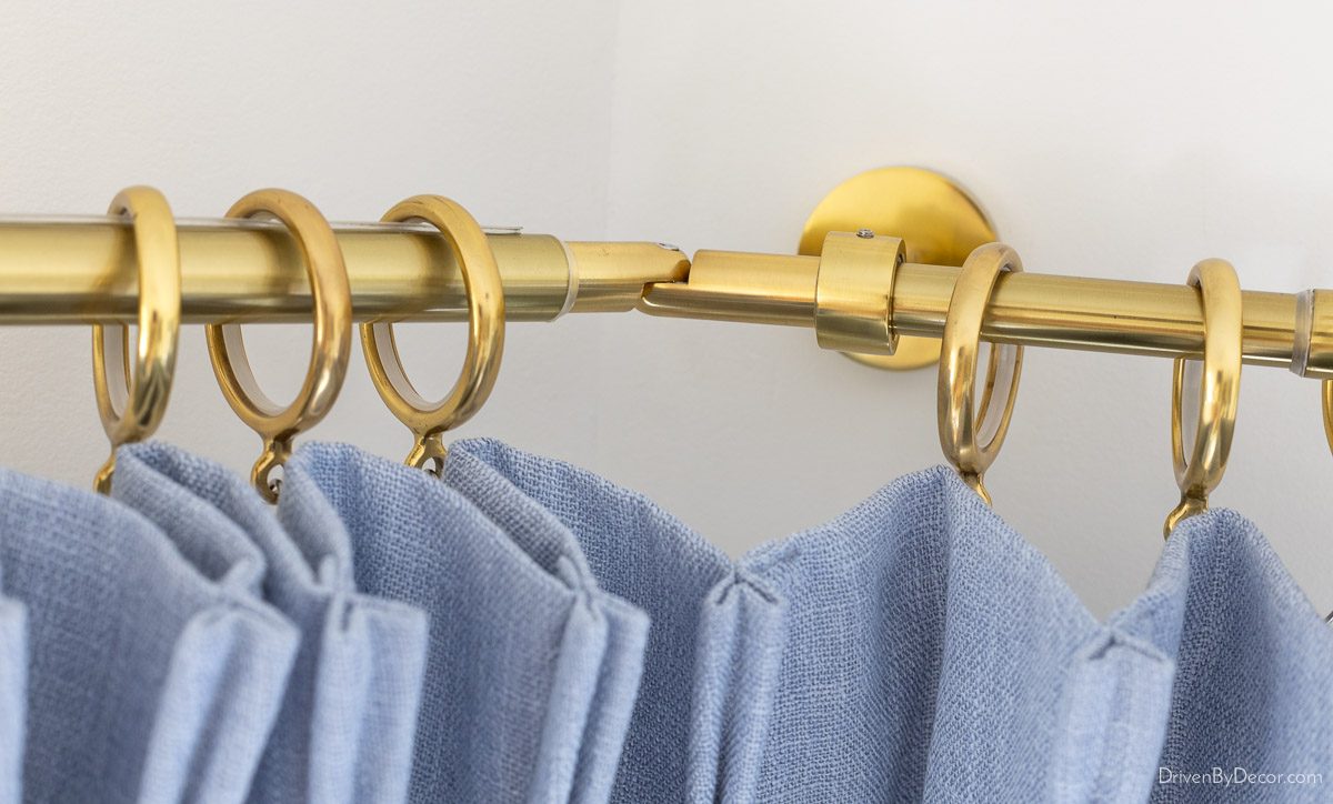 Hinged corner connector for bay window curtain rod