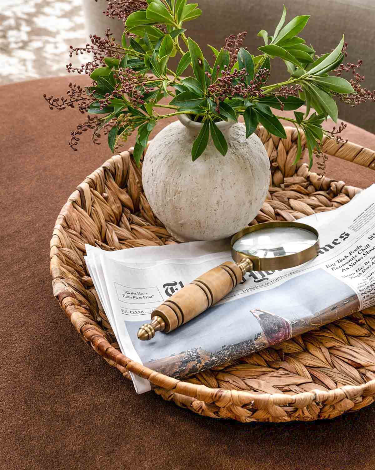 Decorative magnifying glass on woven tray