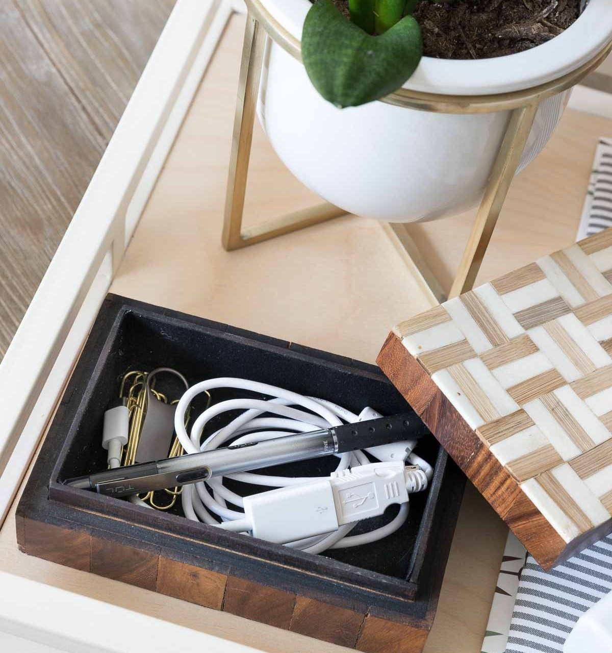 An idea for keeping your desk organized and neat - have a small decorative box for your computer cords, pen, paperclips, and other most-used office supplies