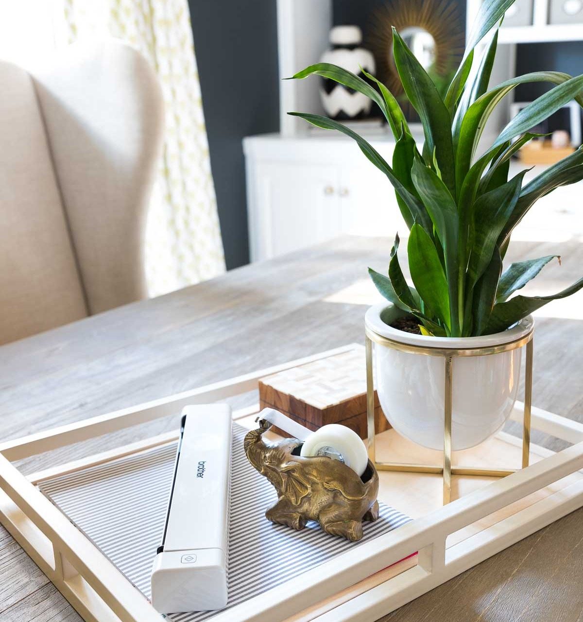 An easy desk organization idea is to have a tray to corral your calendar, paperwork, and most used desk supplies