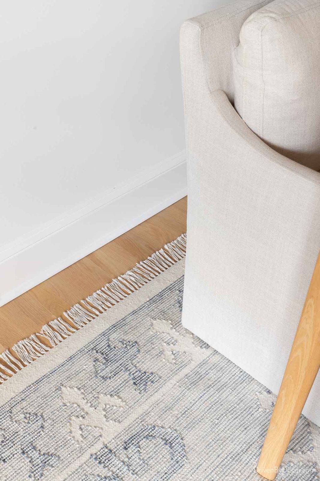 Space between wall and edge of dining rug area rug