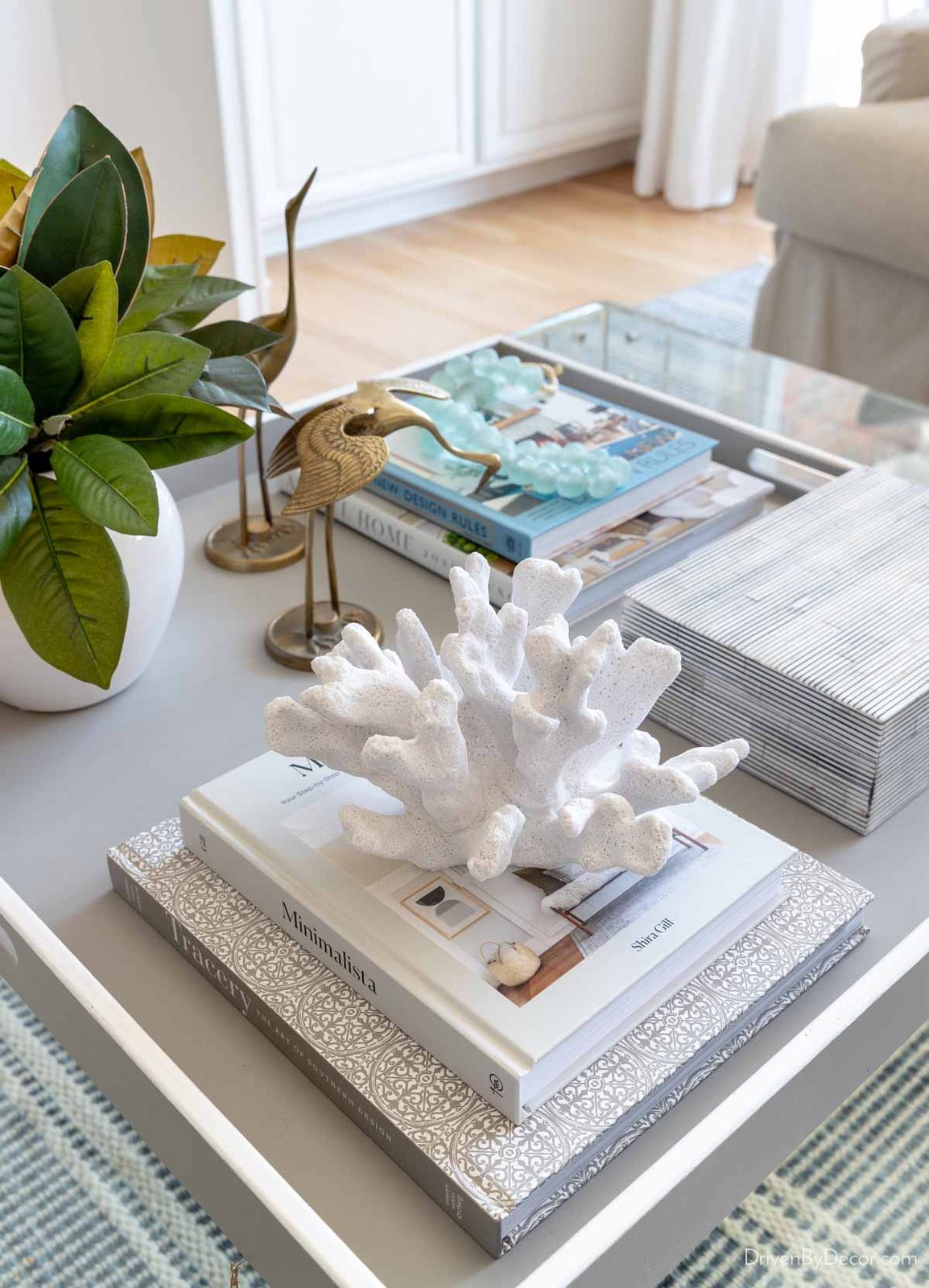 Faux coral on a stack of coffee table books