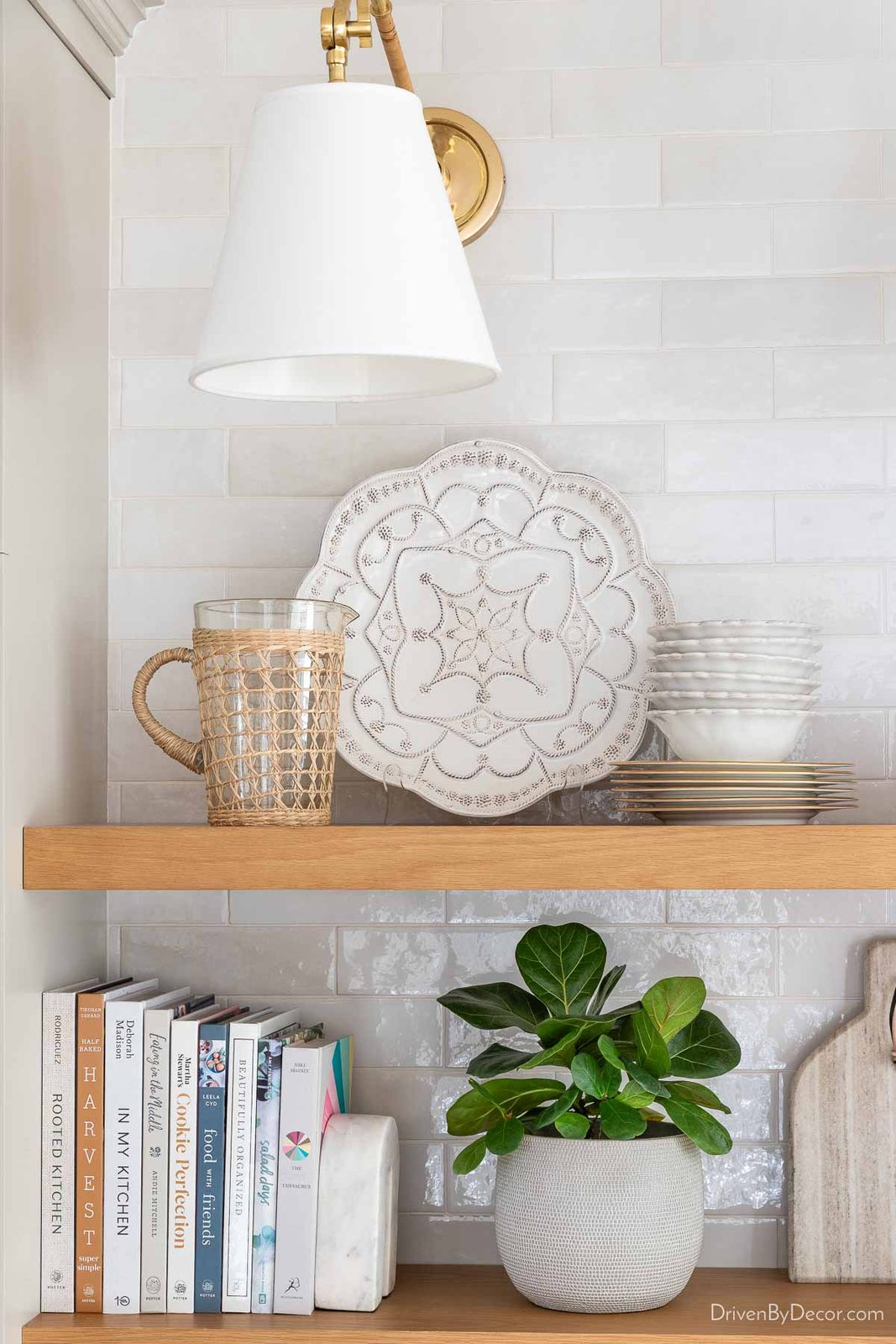 Floating shelves on our kitchen coffee bar with serving pieces displayed