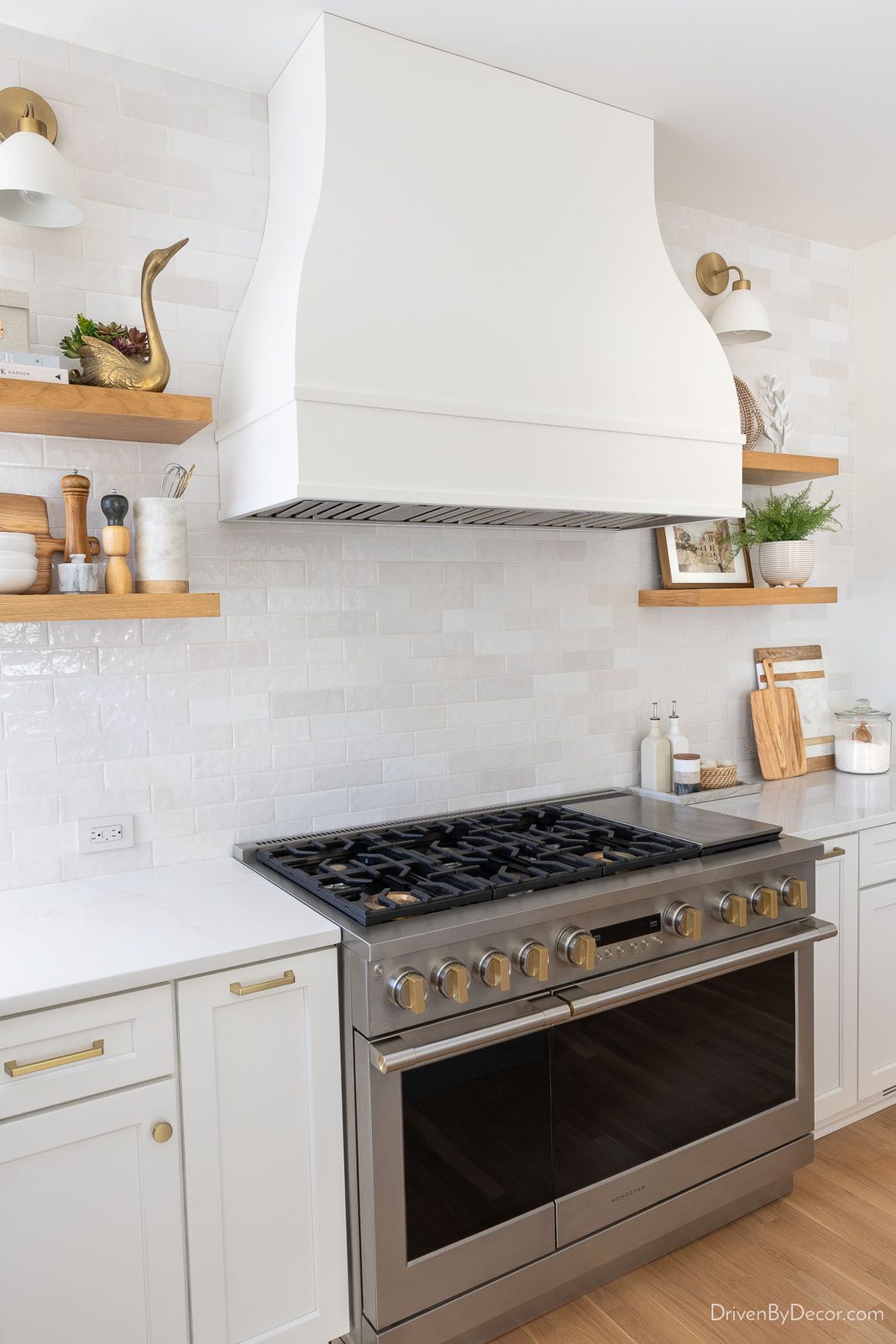 Floating wood shelves on kitchen range wall