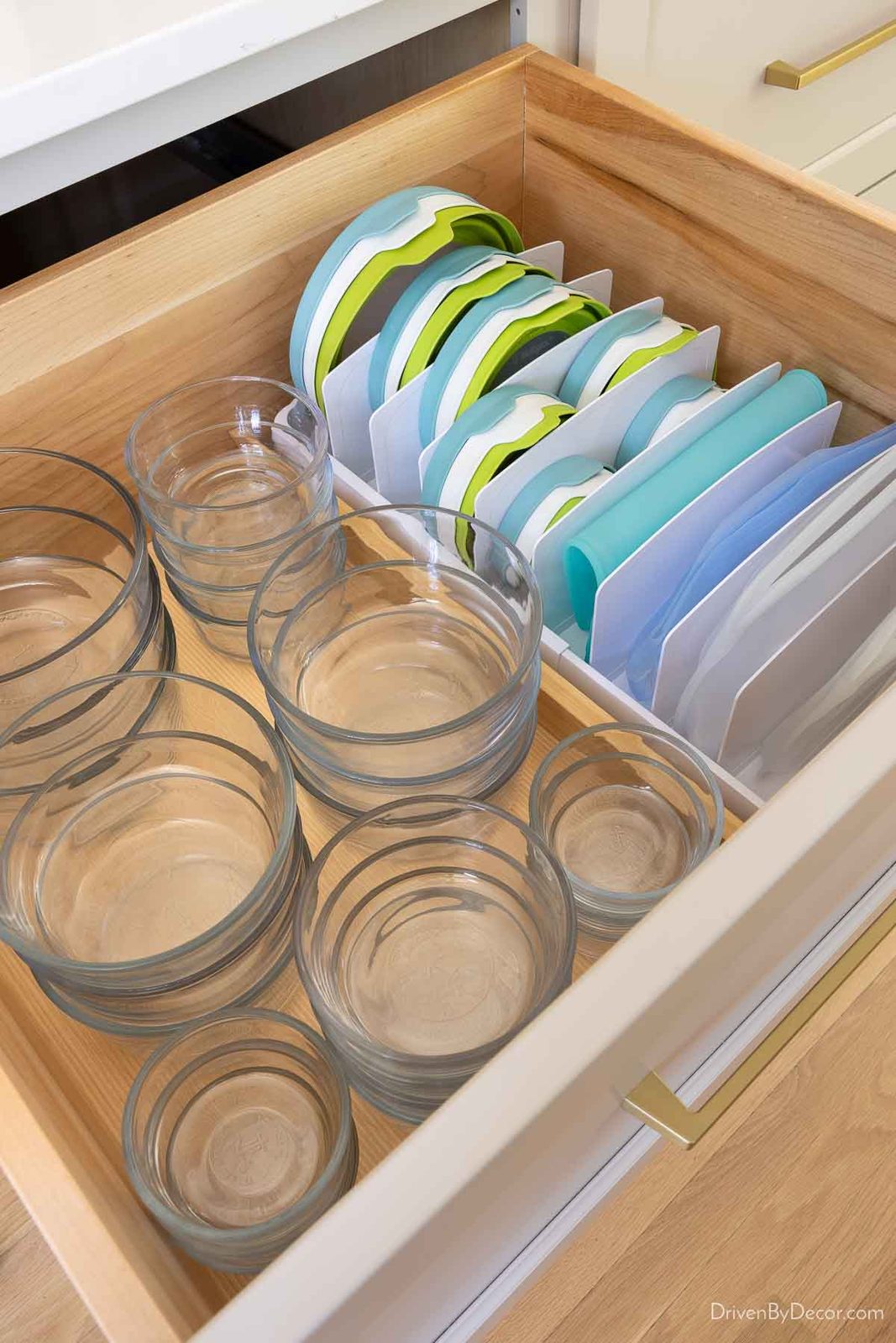 Food storage containers organized in kitchen drawers with bowls and lids store separately