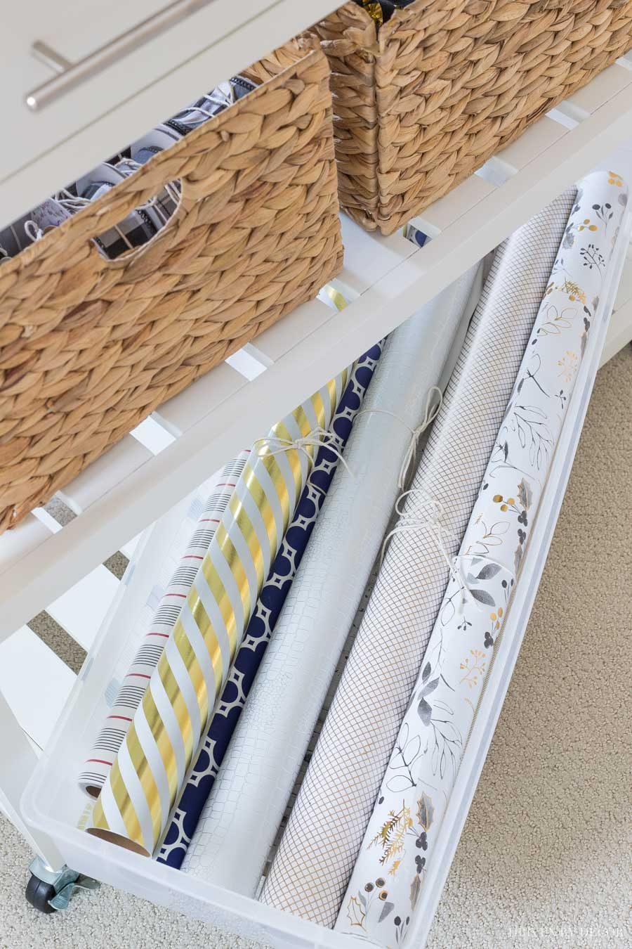 The perfect sized storage bin for rolls of gift wrapping paper!