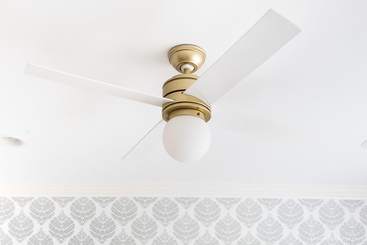 Favorite ceiling fan with brass base and white blades