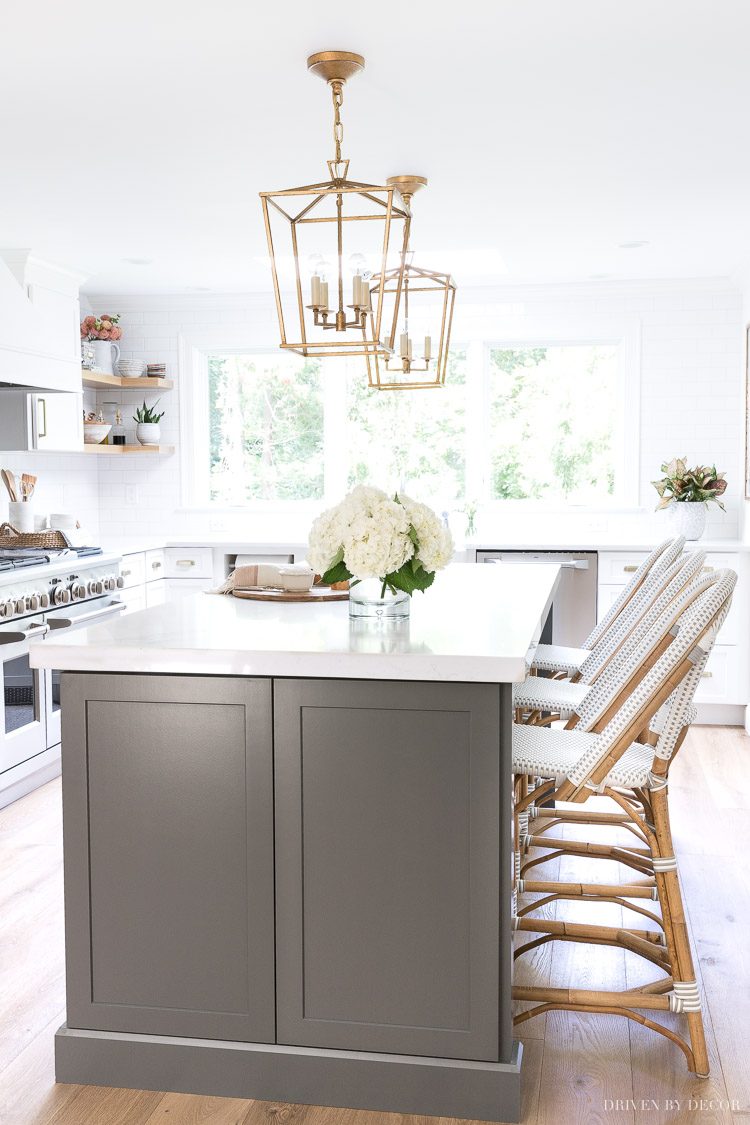 The makeover reveal of our new gray and white kitchen with quartz countertops, Monogram appliances, gold accents, and gorgeous floors! Love!