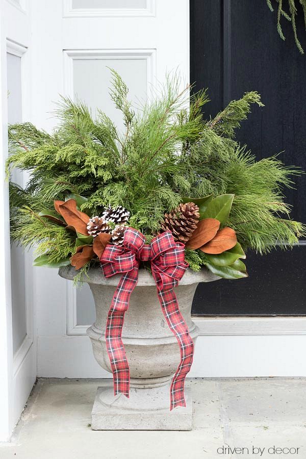 Christmas home tour - create festive Christmas / winter planters by adding greenery branches and pinecones to a pair of planters