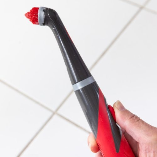 Spinbrush with grout head