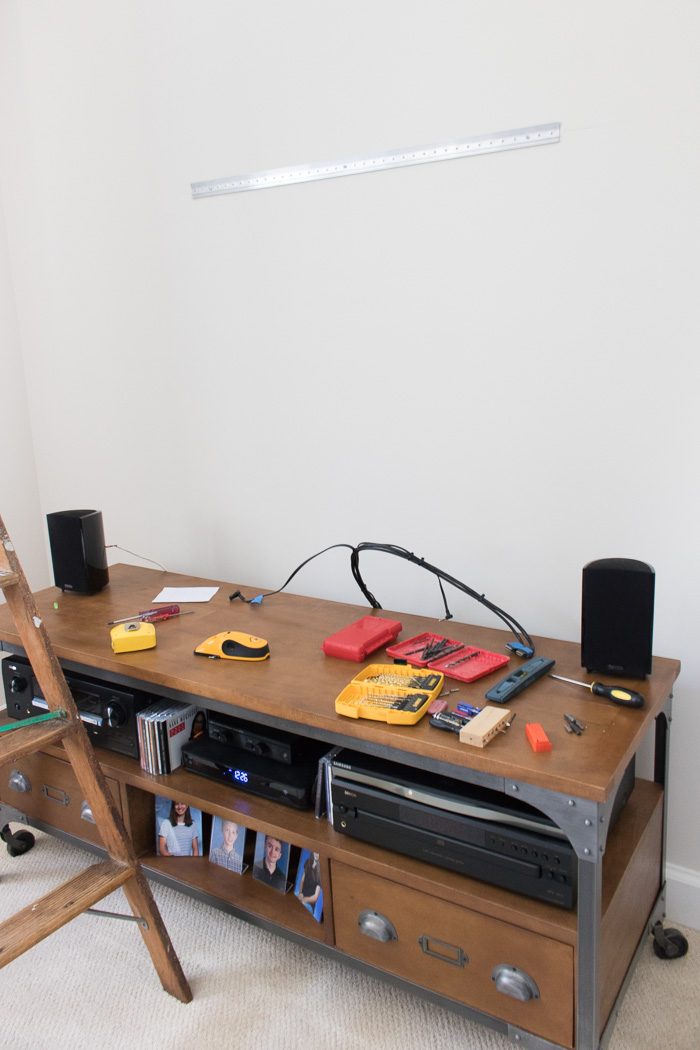Hanging an art ledge shelf above a TV and media console