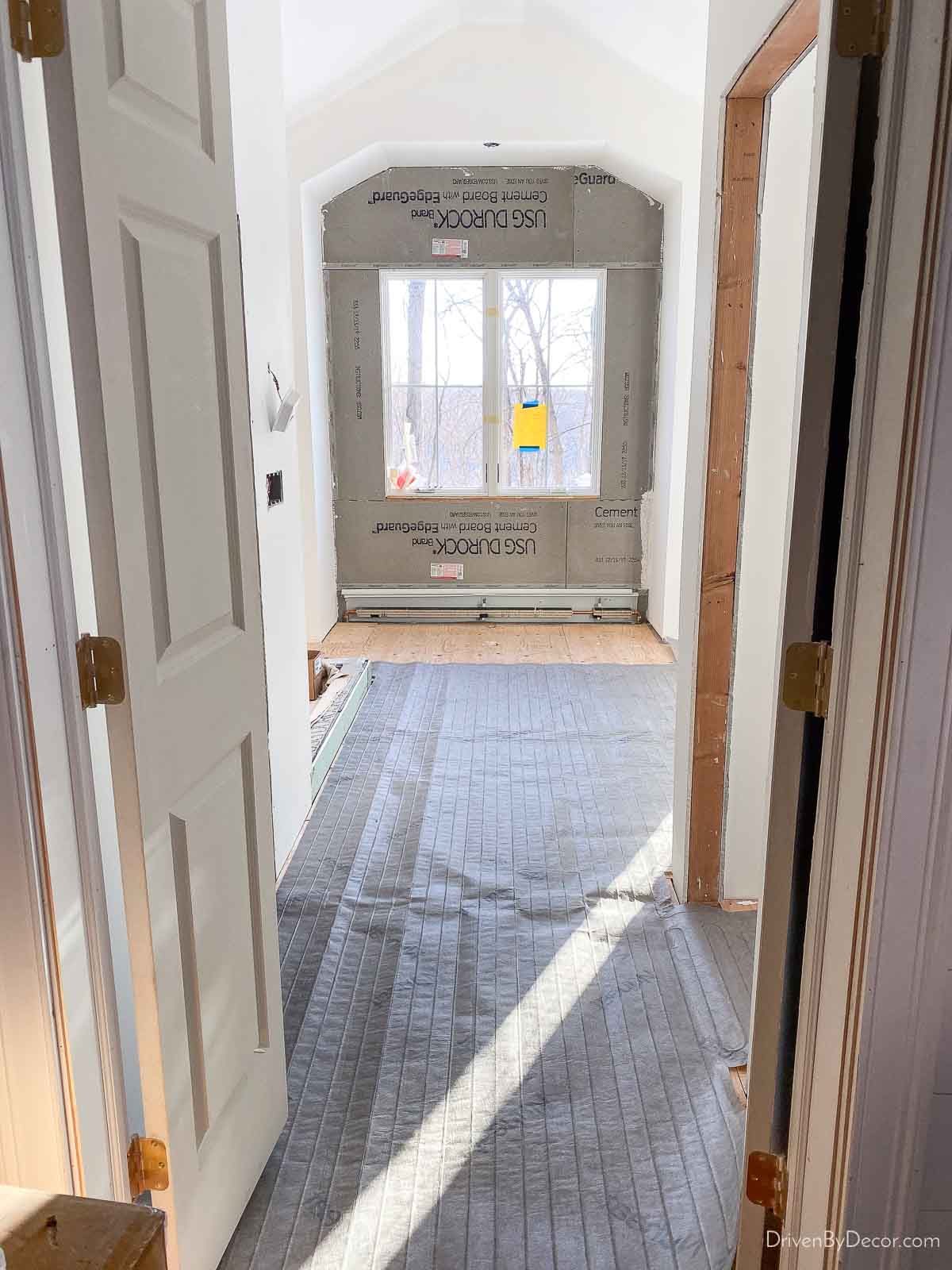Nuheat custom heated floor mat laid out in bathroom