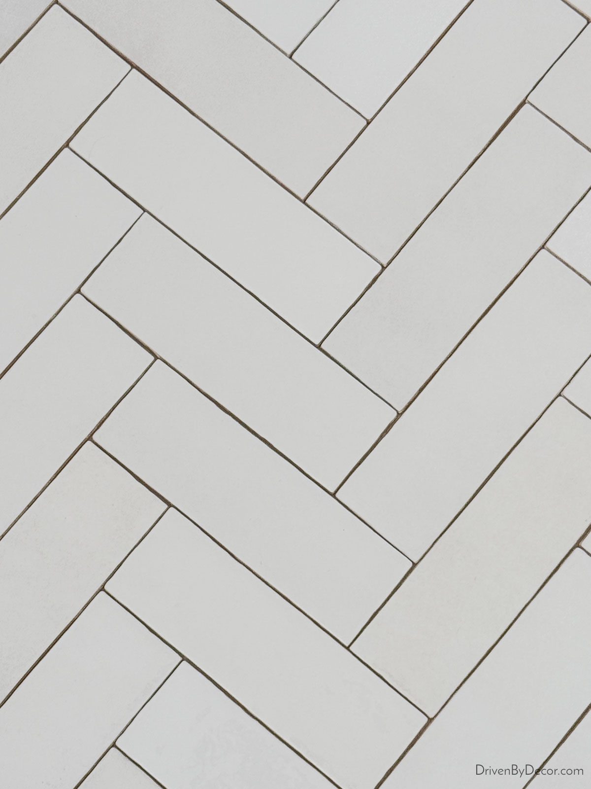 Subway tile laid in herringbone pattern
