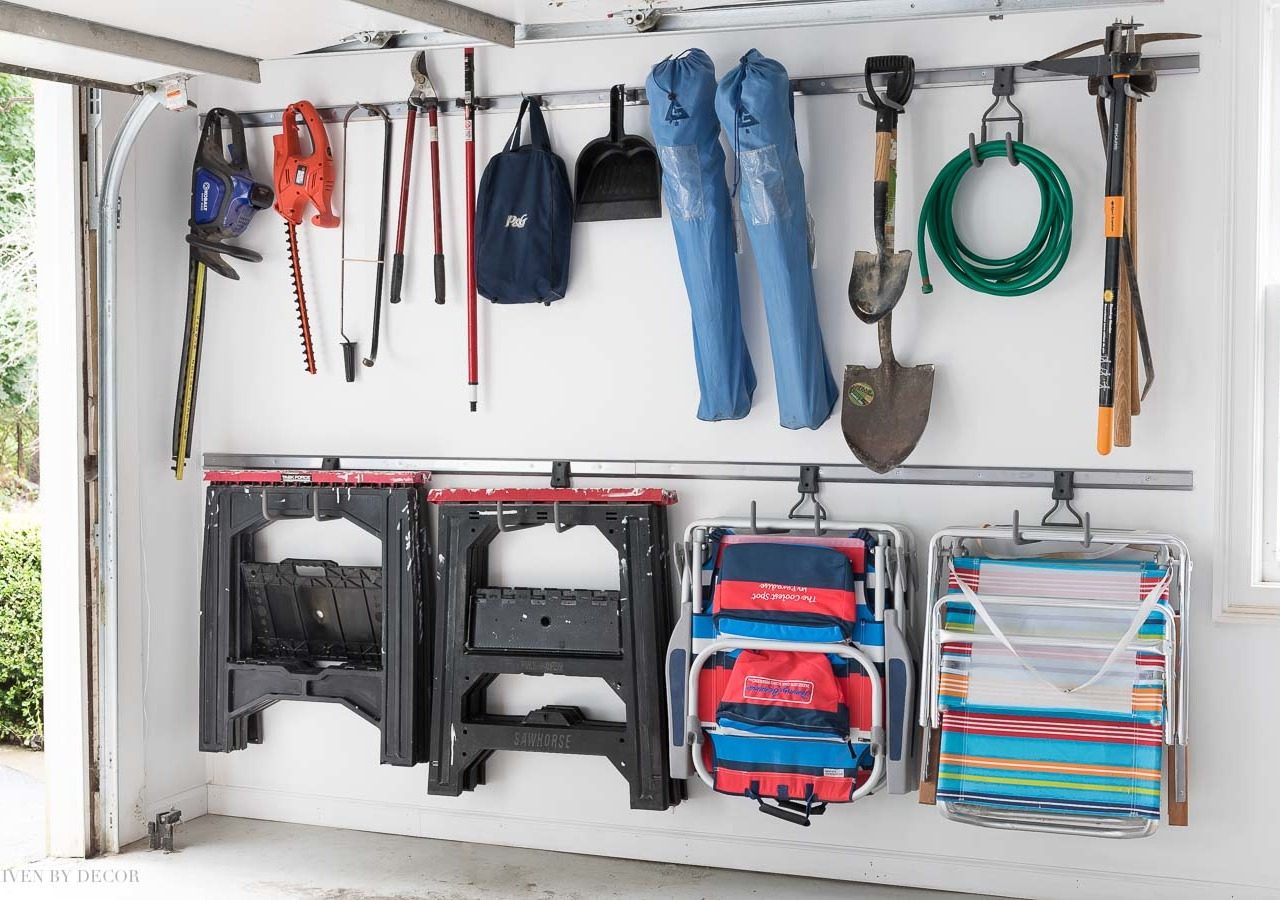 I'm getting so many ideas for organizing our garage from this post! Love this Elfa system for hanging tools!