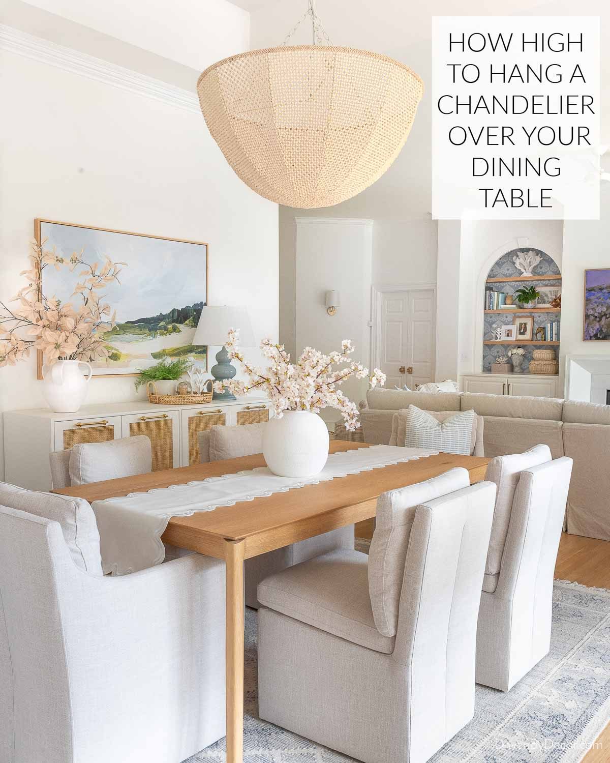 Chandelier over dining room table with text - How high to hang chandelier over dining table