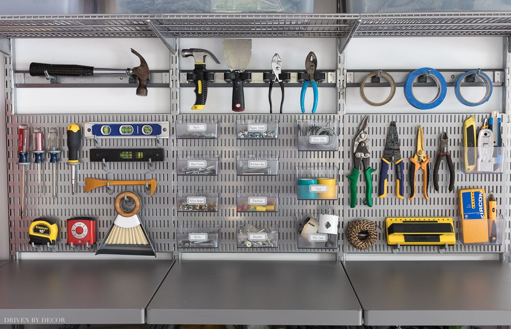 How I organized my most used hardware and tools in our garage! Love Elfa's utility boards, hooks, and bins!