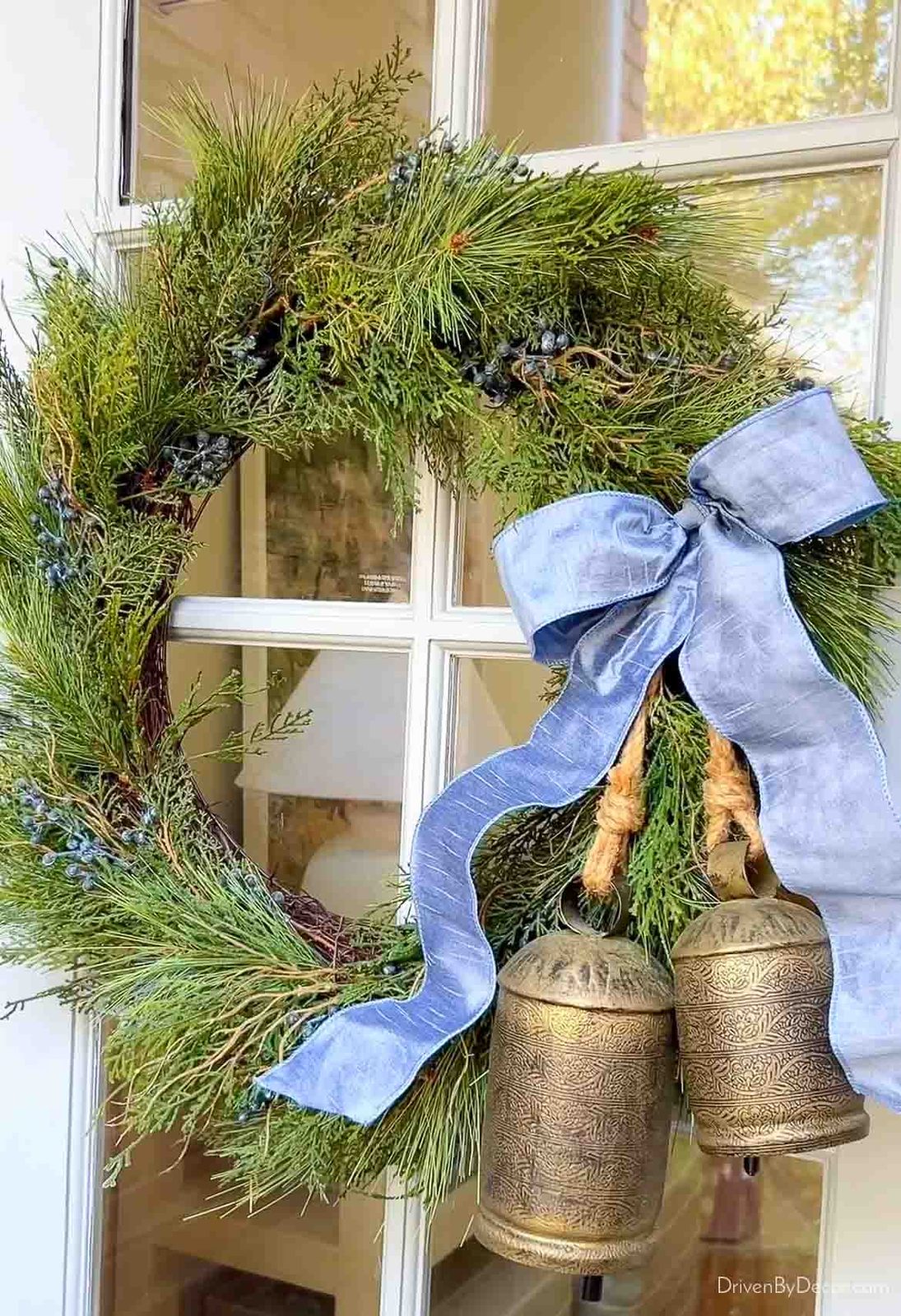 Juniper wreath with a pair of brass bells