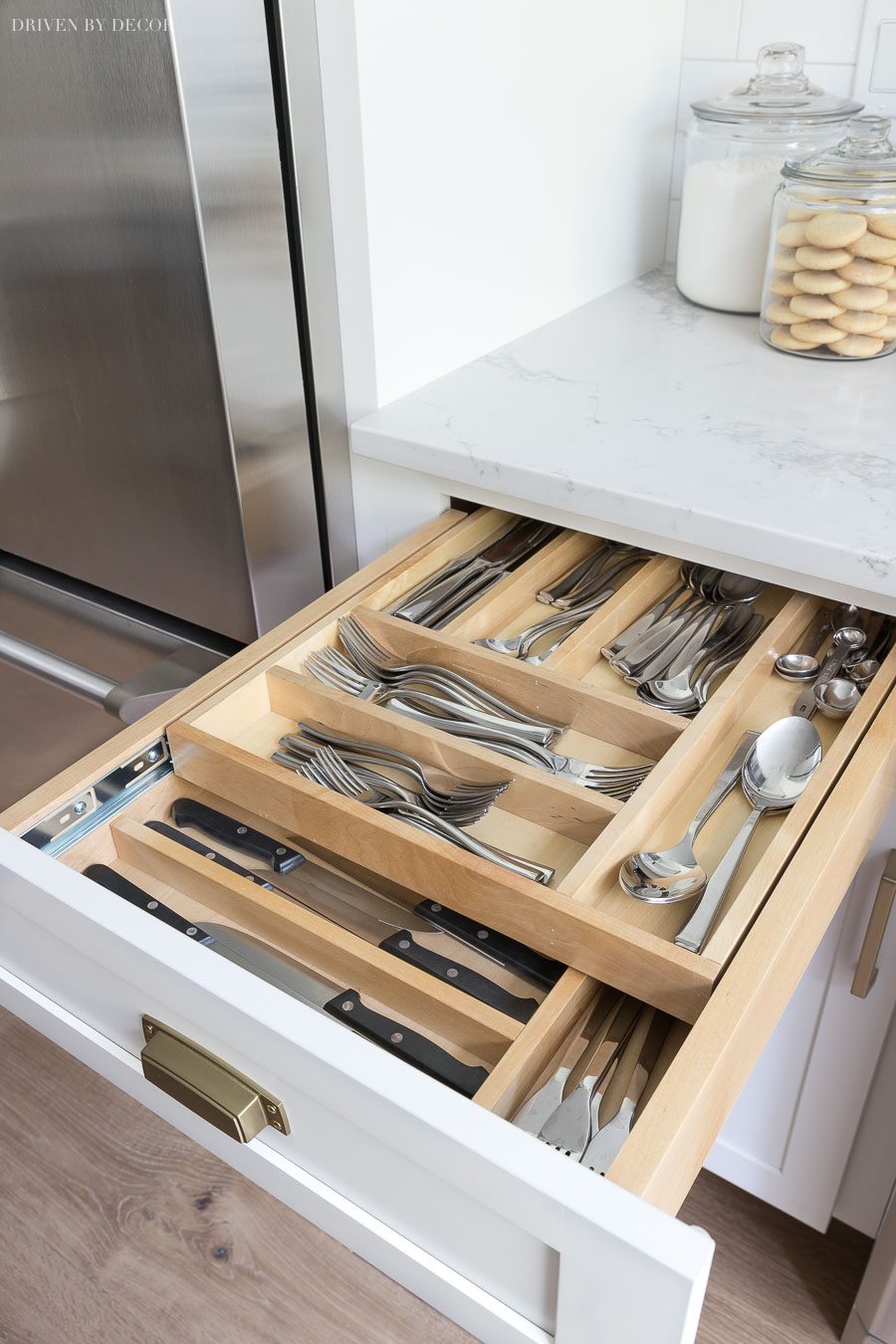 Two tiered divided cutlery drawer - put your most used silverware on the top and have room for steak knives and other less commonly used cutlery on the bottom!