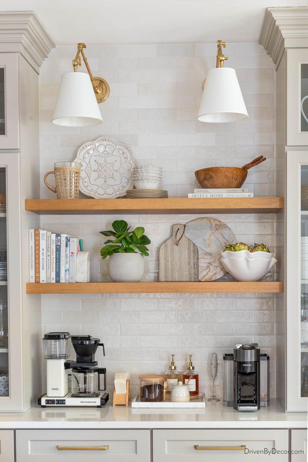 Kitchen coffee bar with sconce lighting and floating shelves