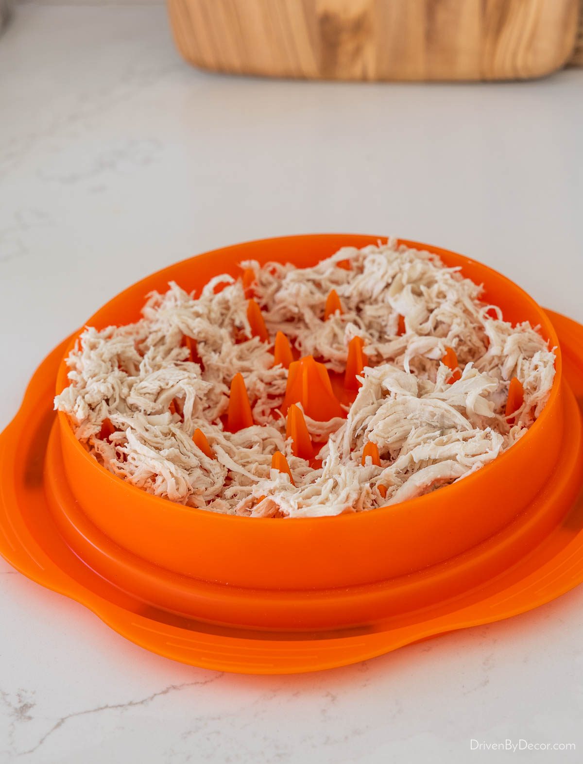Chicken shredding gadget with shredded chicken