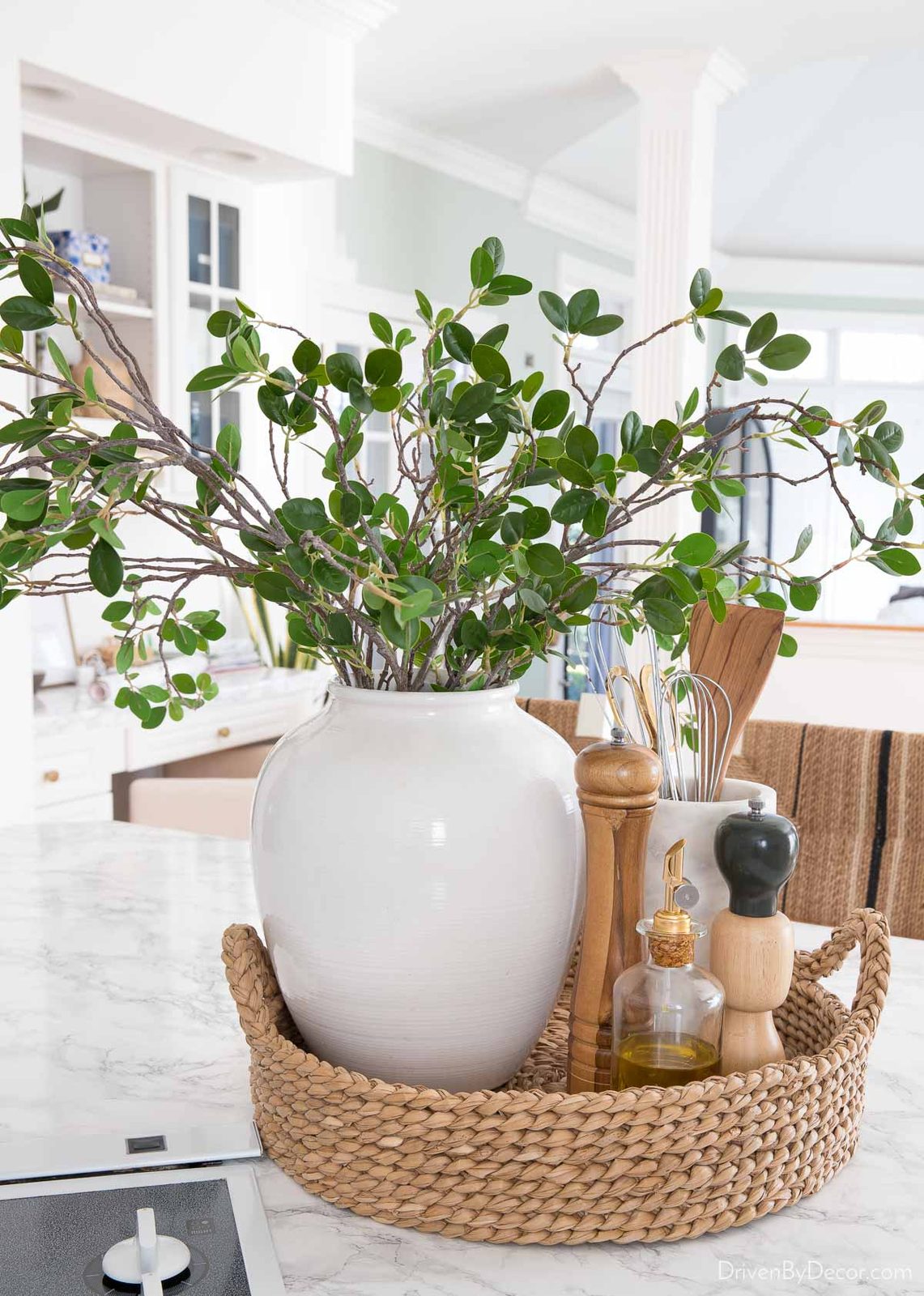 Round woven tray with most used cooking tools near our cooktop