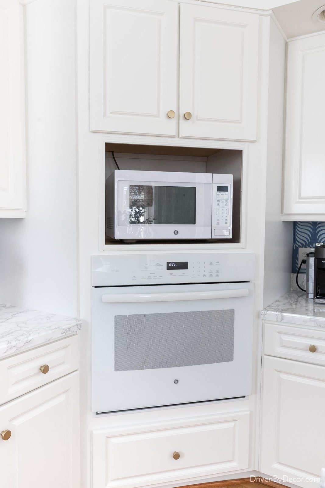 Painting our cabinet trim was a budget friendly part of our kitchen remodel!