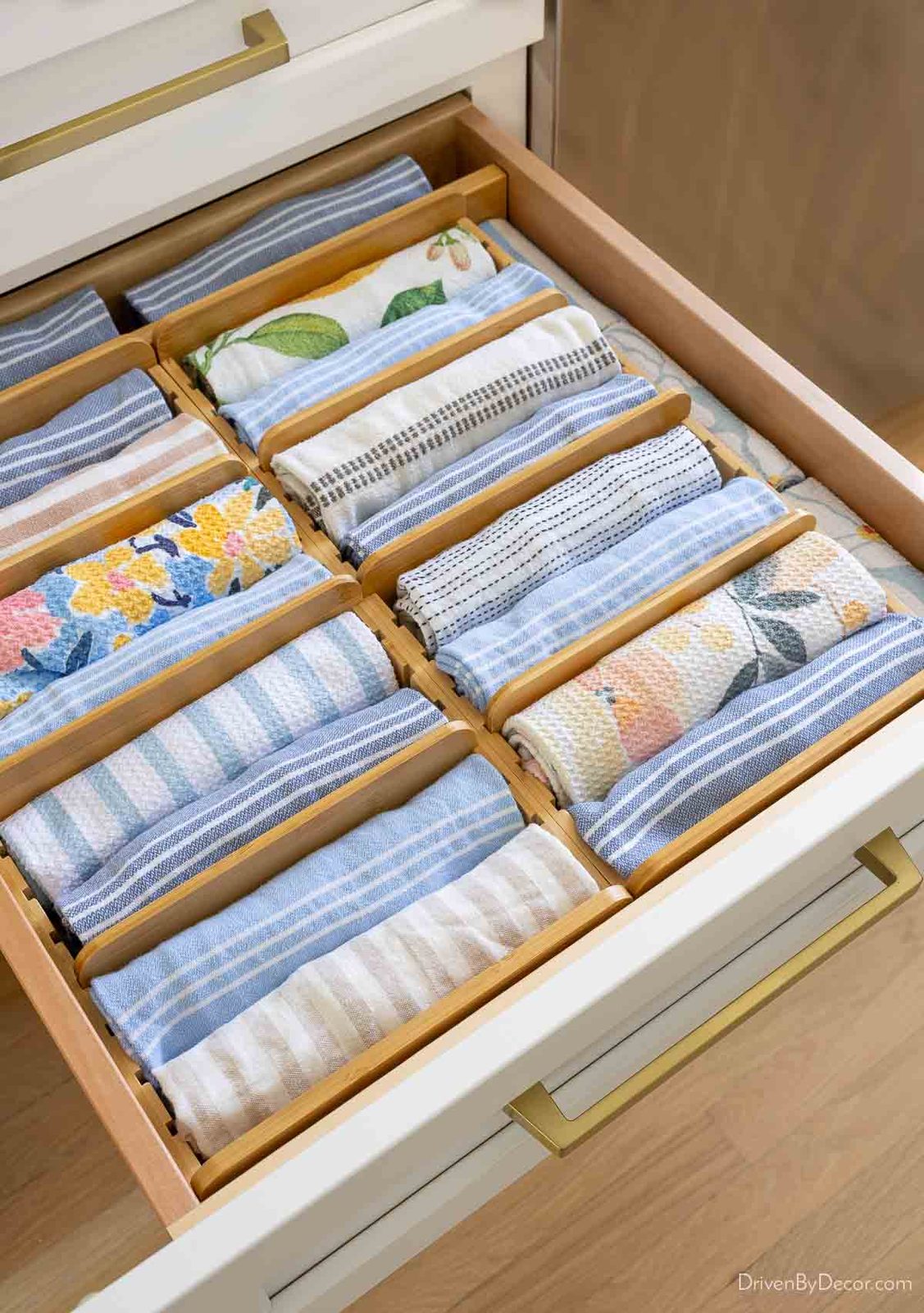 Bamboo kitchen towel drawer organizer with rolled towels