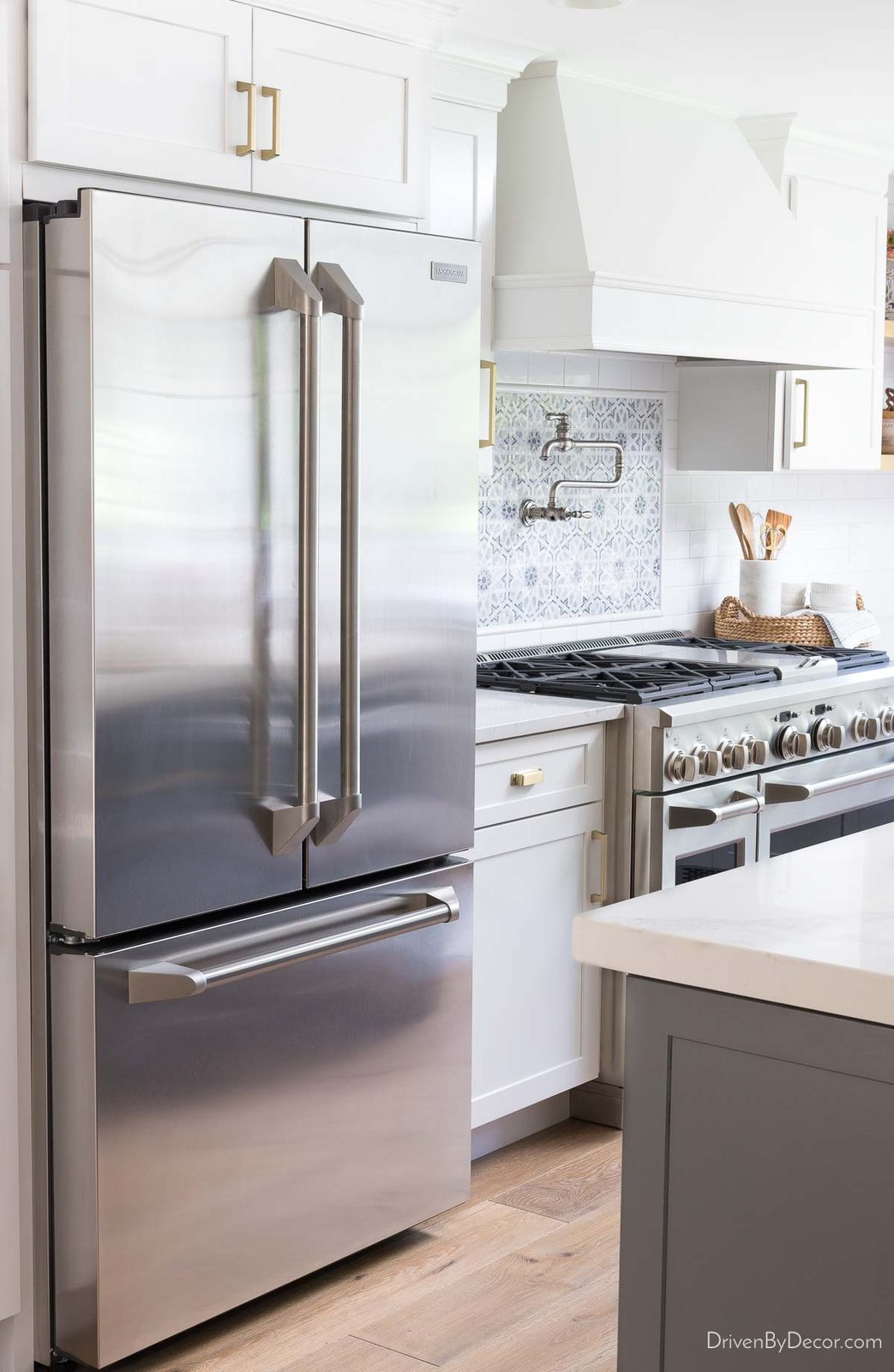 Monogram refrigerator in renovated kitchen