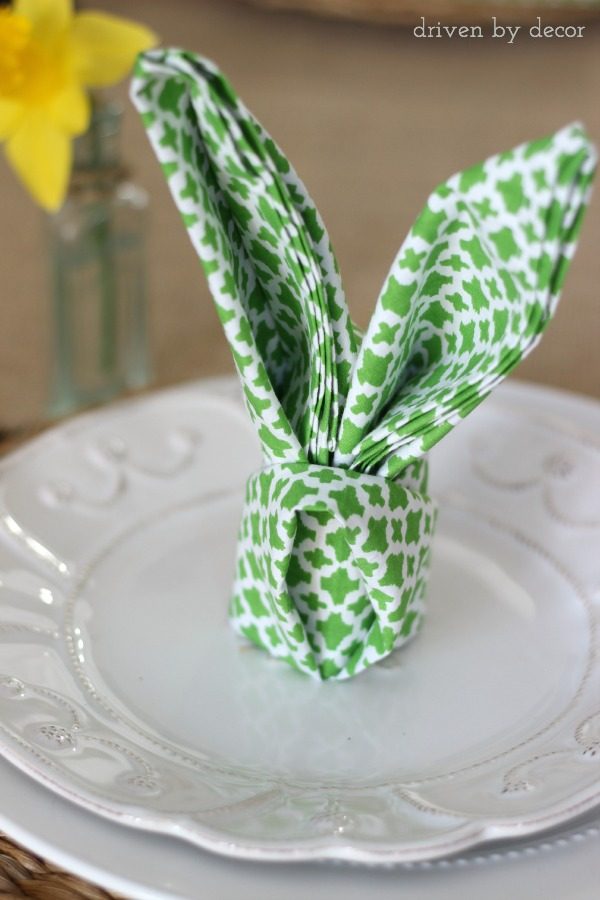 Napkin folded into rabbit ears - so cute for an Easter table setting!
