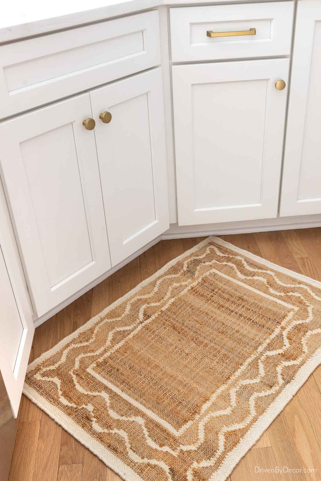 Natural patterned rug in front of kitchen sink