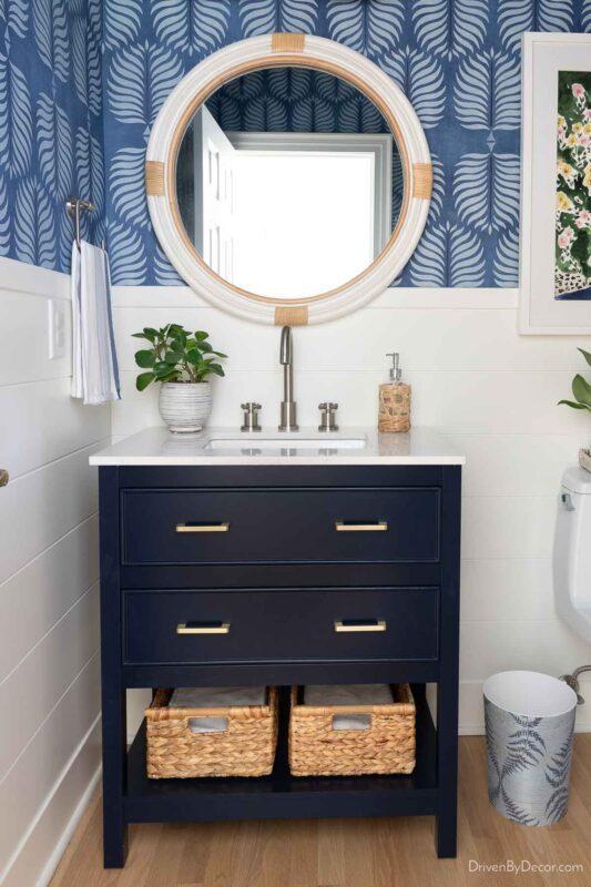 Navy vanity in powder room